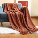 Decorative knitted throw blankets