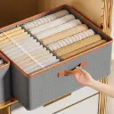 Foldable double compartment closet organizer with a divider 